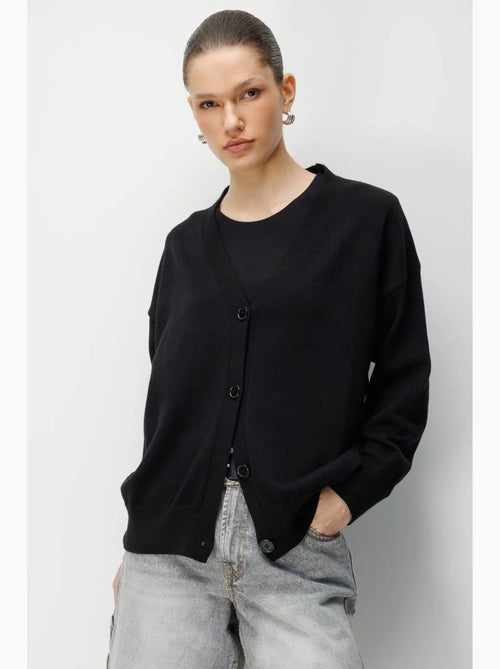 Lang geribd gebreid vest met v-hals en knoopsluiting mixray - Kiabi Lang geribd gebreid vest met v-hals en knoopsluiting mixray - Kiabi