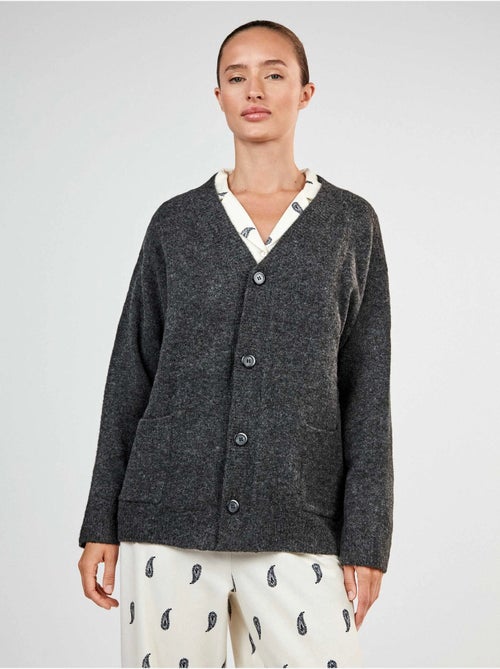 Lange gebreide vest met knopen - Kiabi Lange gebreide vest met knopen - Kiabi