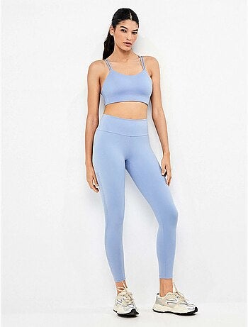 Lange legging gemaakt van vormgevend materiaal dat definieert en styliseert