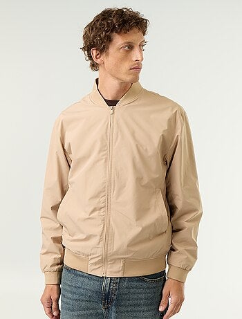 Lichte effen jas met rits