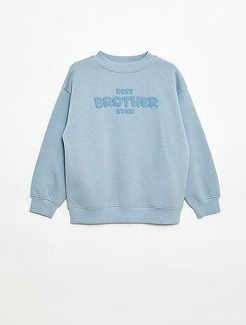 Loose sweater met "brother"-motief