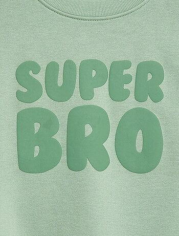 Loose sweater met "brother"-motief