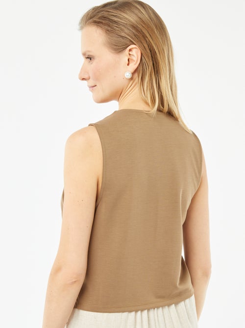 Luchtig, mouwloos jasje met knoopsluiting - Kiabi