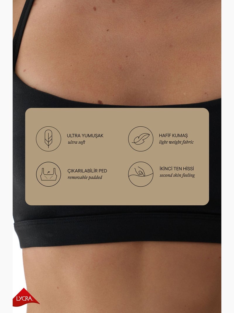 Lycra sport-bh met lichte ondersteuning, uitneembare pads en racerback penti Zwart - Kiabi