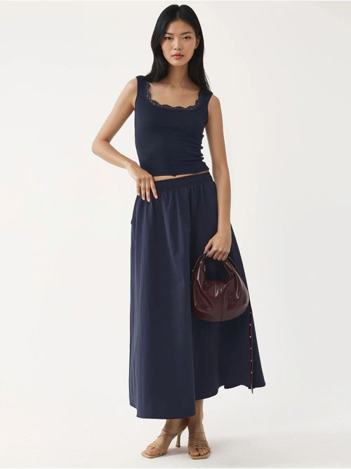 Midi-rok met elastische taille en zakken busem - Kiabi Midi-rok met elastische taille en zakken busem - Kiabi
