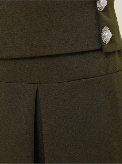 Mini-jupe plissée avec détails en perles - Kiabi Mini-jupe plissée avec détails en perles - Kiabi
