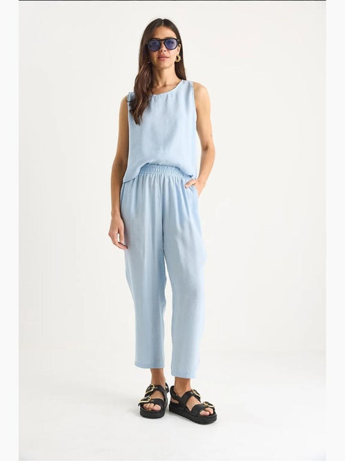Mouwloze blouse met ronde hals en carrof fıt-broek set lucci - Kiabi Mouwloze blouse met ronde hals en carrof fıt-broek set lucci - Kiabi