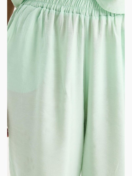 Mouwloze blouse met ronde hals en carrof fıt-broek set lucci - Kiabi