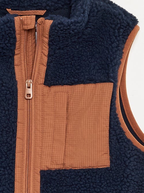 Mouwloze bodywarmer met schapenvachteffect - Kiabi Mouwloze bodywarmer met schapenvachteffect - Kiabi