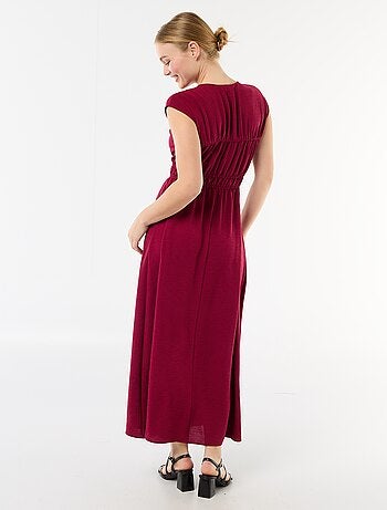 Mouwloze lange jurk met knoop