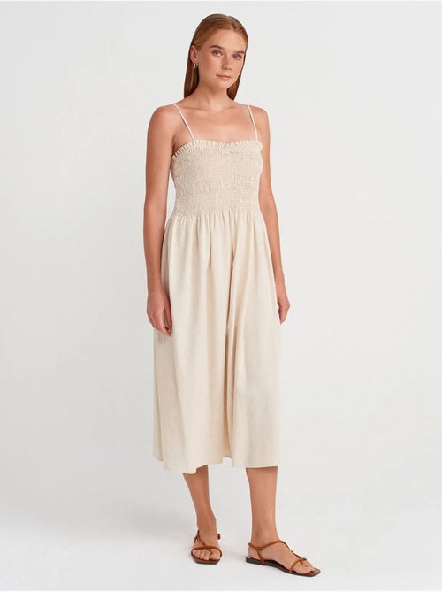 Mouwloze midi-jurk met a-lijn en bandeau dilvin - Kiabi Mouwloze midi-jurk met a-lijn en bandeau dilvin - Kiabi