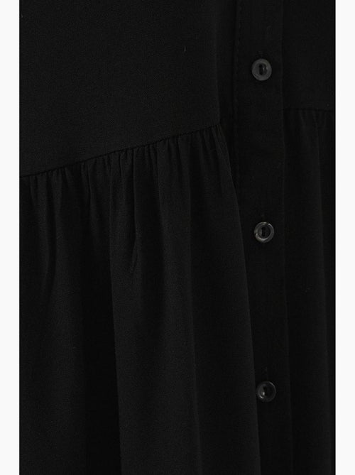 Mouwloze midi-jurk met knopen en overhemdkraag bdart - Kiabi Mouwloze midi-jurk met knopen en overhemdkraag bdart - Kiabi