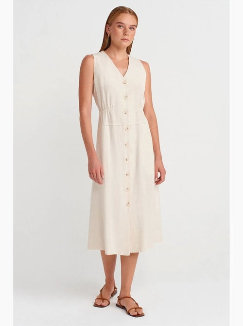 Mouwloze midi-jurk met v-hals en knopen dilvin - Kiabi Mouwloze midi-jurk met v-hals en knopen dilvin - Kiabi