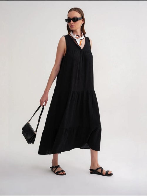 Mouwloze midi-jurk van mousseline met v-hals en zakken mixray - Kiabi Mouwloze midi-jurk van mousseline met v-hals en zakken mixray - Kiabi