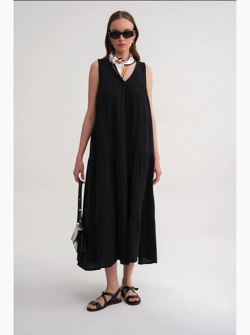 Mouwloze midi-jurk van mousseline met v-hals en zakken mixray - Kiabi Mouwloze midi-jurk van mousseline met v-hals en zakken mixray - Kiabi