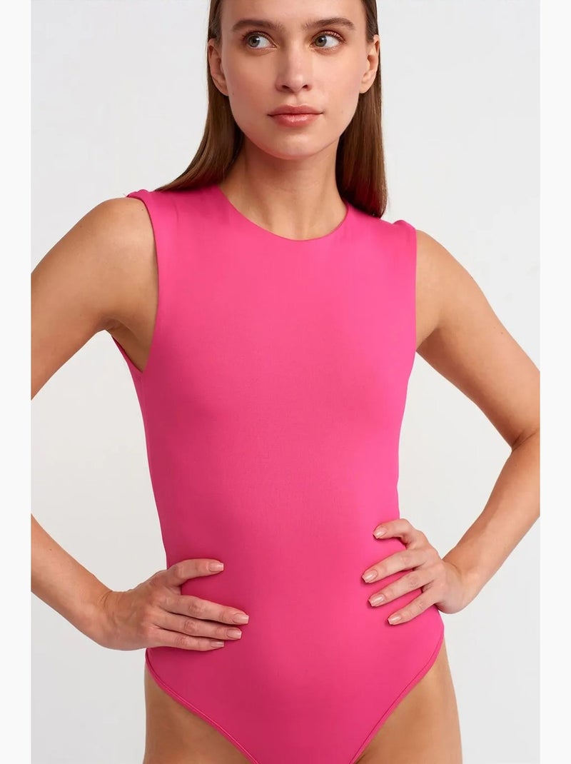Naadloze mouwloze slim-fit unitard dilvin Fluorroze/Solinotes - Kiabi