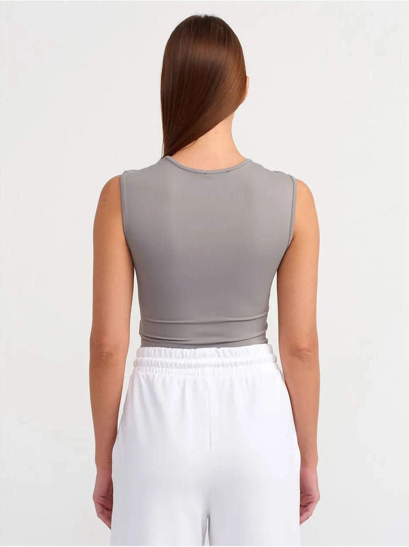 Naadloze mouwloze slim-fit unitard dilvin Grijs - Kiabi