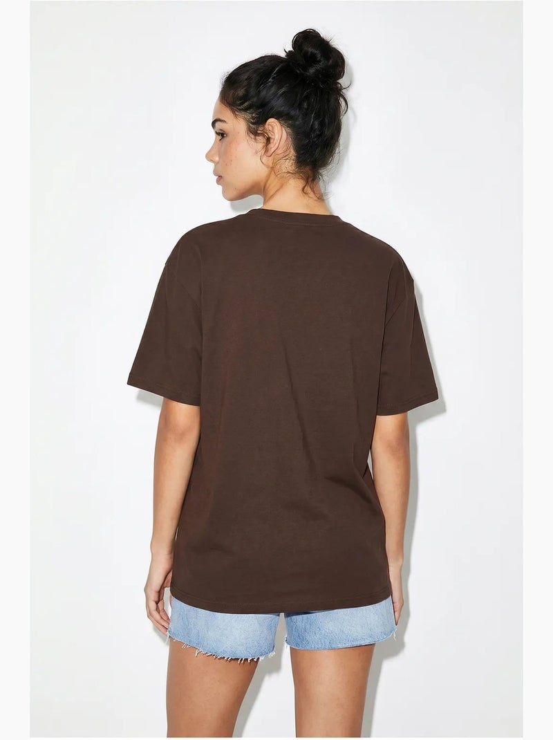 Oversized t-shirt van katoenen jersey met print lucci Bruin - Kiabi