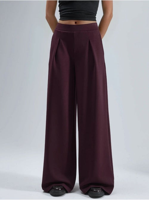Palazzo-broek met elastische taille en plooien busem - Kiabi Palazzo-broek met elastische taille en plooien busem - Kiabi