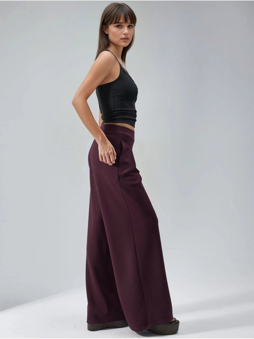 Palazzo-broek met elastische taille en plooien busem - Kiabi Palazzo-broek met elastische taille en plooien busem - Kiabi