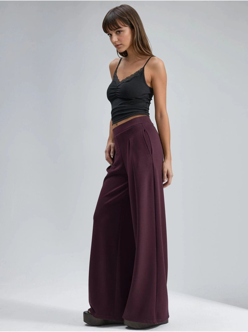 Palazzo-broek met elastische taille en plooien busem Bordeauxrood - Kiabi