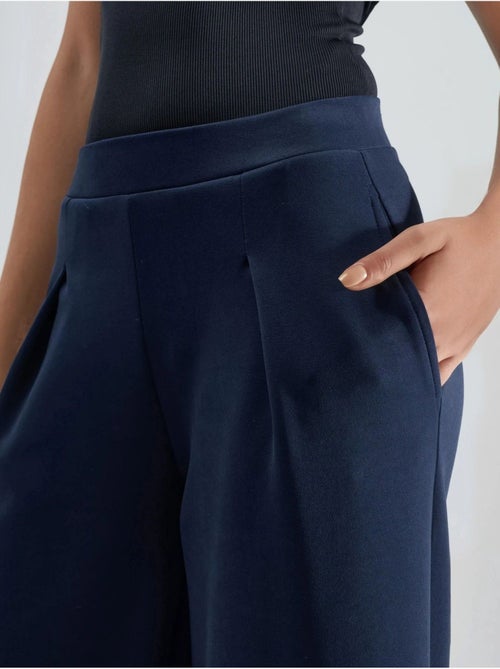 Palazzo-broek met elastische taille en plooien busem - Kiabi Palazzo-broek met elastische taille en plooien busem - Kiabi
