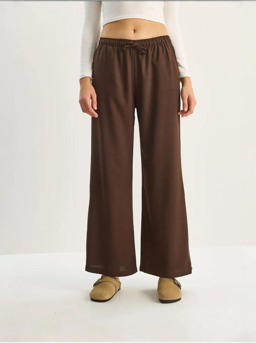 Palazzo-broek met wijde pijpen en striksluiting lucci - Kiabi Palazzo-broek met wijde pijpen en striksluiting lucci - Kiabi