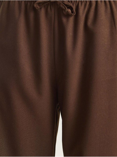 Palazzo-broek met wijde pijpen en striksluiting lucci - Kiabi Palazzo-broek met wijde pijpen en striksluiting lucci - Kiabi