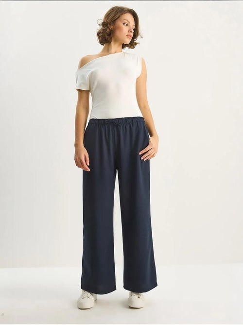 Palazzo-broek met wijde pijpen en striksluiting lucci - Kiabi Palazzo-broek met wijde pijpen en striksluiting lucci - Kiabi