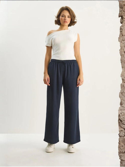 Palazzo-broek met wijde pijpen en striksluiting lucci - Kiabi Palazzo-broek met wijde pijpen en striksluiting lucci - Kiabi