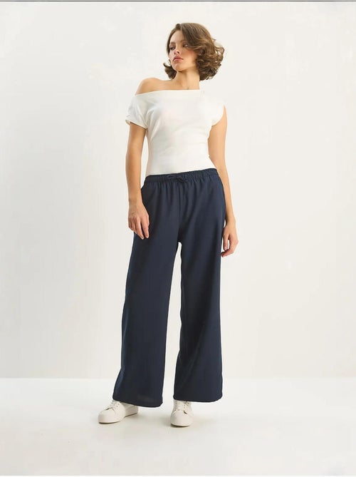Palazzo-broek met wijde pijpen en striksluiting lucci - Kiabi Palazzo-broek met wijde pijpen en striksluiting lucci - Kiabi