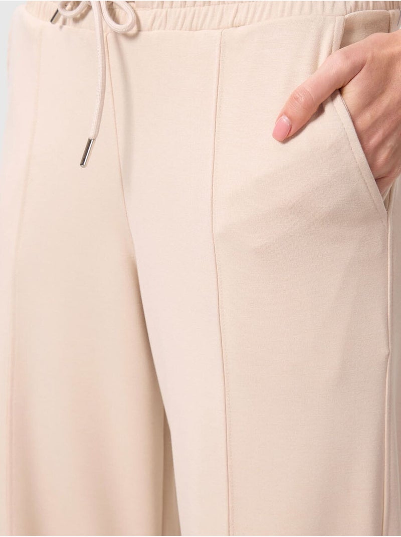 Palazzo broek met wijde pijpen en textuur, met trekkoord in de taille. Tommy Klei-beige - Kiabi