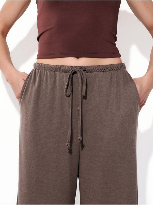 Pantalon à jambe large avec cordon de serrage busem - Kiabi Pantalon à jambe large avec cordon de serrage busem - Kiabi