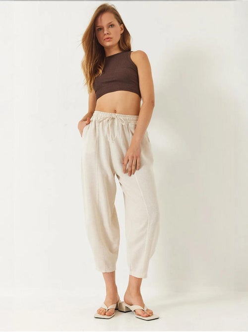 Pantalon à taille élastique et entrejambe bas avec poches lucci - Kiabi Pantalon à taille élastique et entrejambe bas avec poches lucci - Kiabi