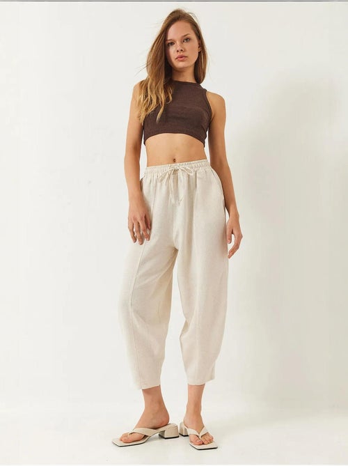Pantalon à taille élastique et entrejambe bas avec poches lucci - Kiabi Pantalon à taille élastique et entrejambe bas avec poches lucci - Kiabi