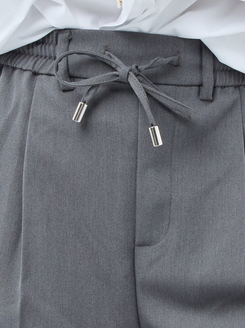 Pantalon coupe large à la taille élastiquée + liens à nouer - Kiabi