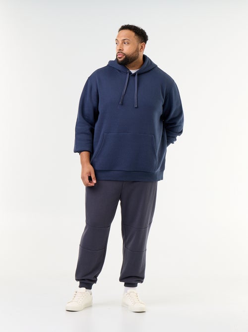 Pantalon de jogging avec bas resserré et poches zippées - Kiabi Pantalon de jogging avec bas resserré et poches zippées - Kiabi