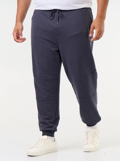 Pantalon de jogging avec bas resserré et poches zippées - Kiabi Pantalon de jogging avec bas resserré et poches zippées - Kiabi