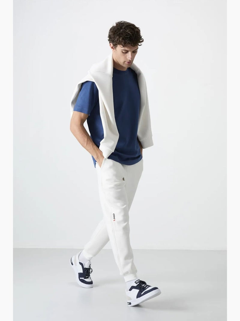 Pantalon de jogging homme à jambe fuselée tommy Blanc cassé - Kiabi