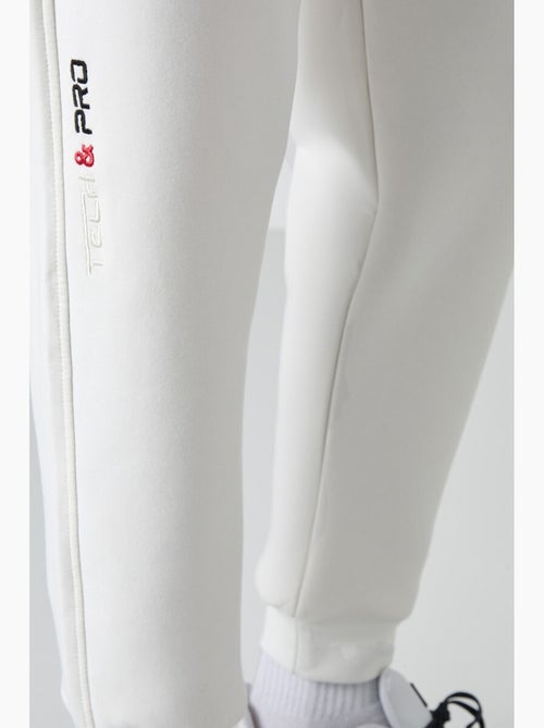 Pantalon de jogging homme à jambe fuselée tommy - Kiabi Pantalon de jogging homme à jambe fuselée tommy - Kiabi