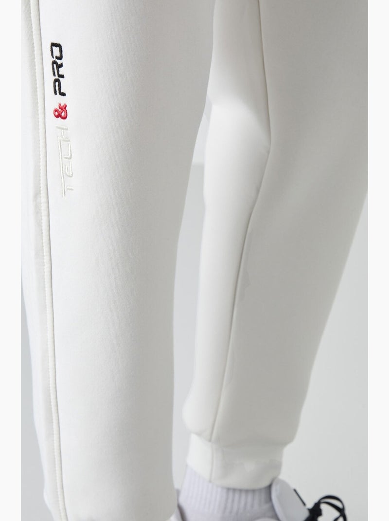 Pantalon de jogging homme à jambe fuselée tommy Blanc cassé - Kiabi