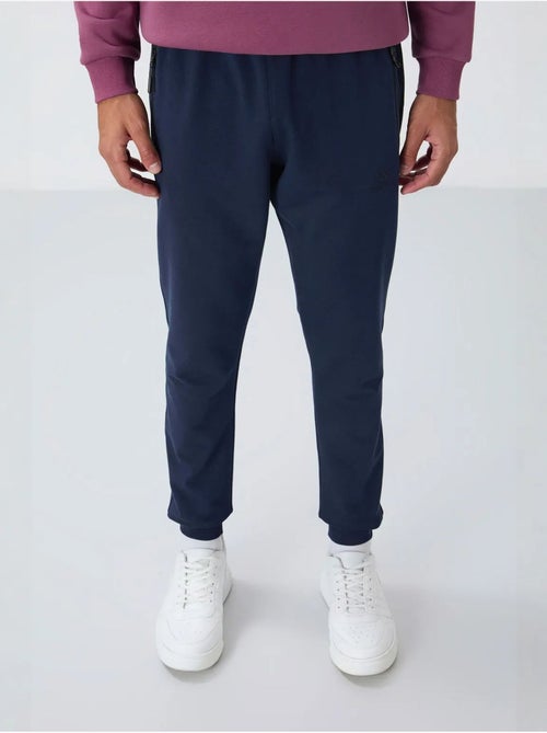 Pantalon de jogging homme avec poche zippée tommy - Kiabi Pantalon de jogging homme avec poche zippée tommy - Kiabi