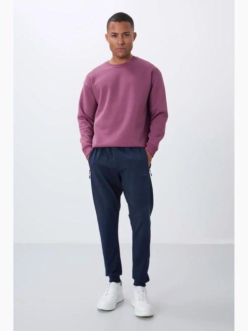 Pantalon de jogging homme avec poche zippée tommy - Kiabi Pantalon de jogging homme avec poche zippée tommy - Kiabi