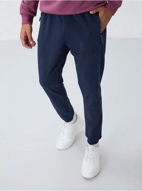 Pantalon de jogging homme avec poche zippée tommy - Kiabi Pantalon de jogging homme avec poche zippée tommy - Kiabi