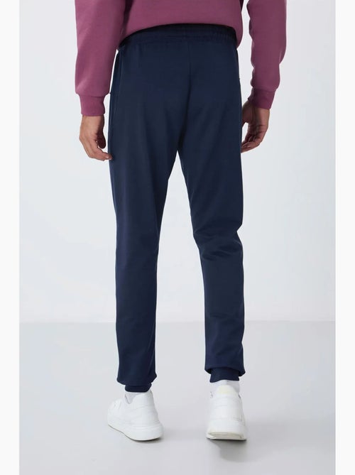Pantalon de jogging homme avec poche zippée tommy - Kiabi Pantalon de jogging homme avec poche zippée tommy - Kiabi