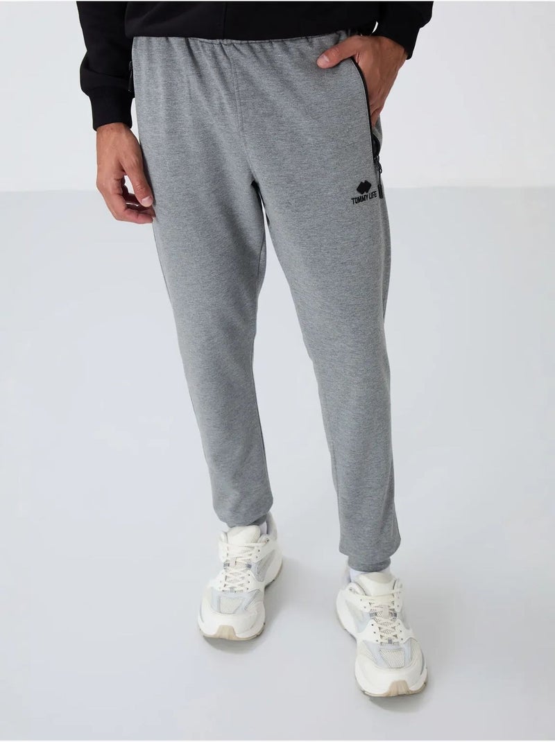 Pantalon de jogging homme avec poche zippée tommy Gris - Kiabi