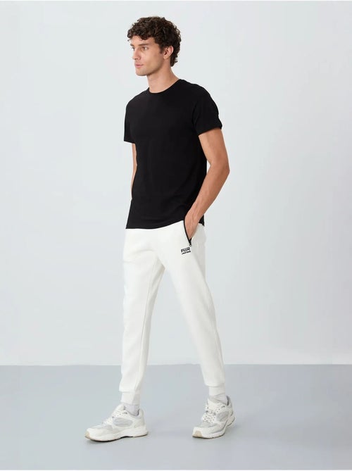 Pantalon de jogging homme coupe jogger tommy - Kiabi Pantalon de jogging homme coupe jogger tommy - Kiabi
