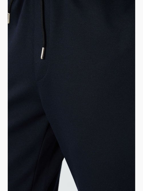 Pantalon de jogging homme coupe regular en molleton tommy - Kiabi Pantalon de jogging homme coupe regular en molleton tommy - Kiabi