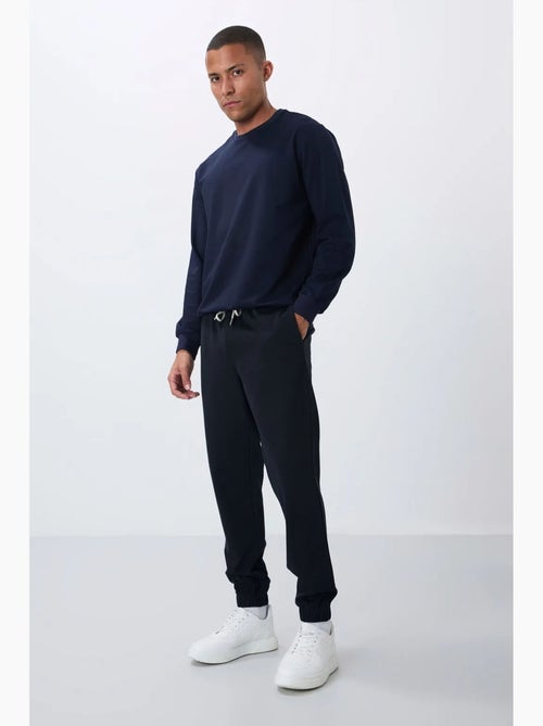 Pantalon de jogging homme coupe regular en molleton tommy - Kiabi Pantalon de jogging homme coupe regular en molleton tommy - Kiabi