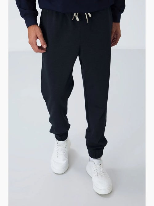 Pantalon de jogging homme coupe regular en molleton tommy - Kiabi Pantalon de jogging homme coupe regular en molleton tommy - Kiabi